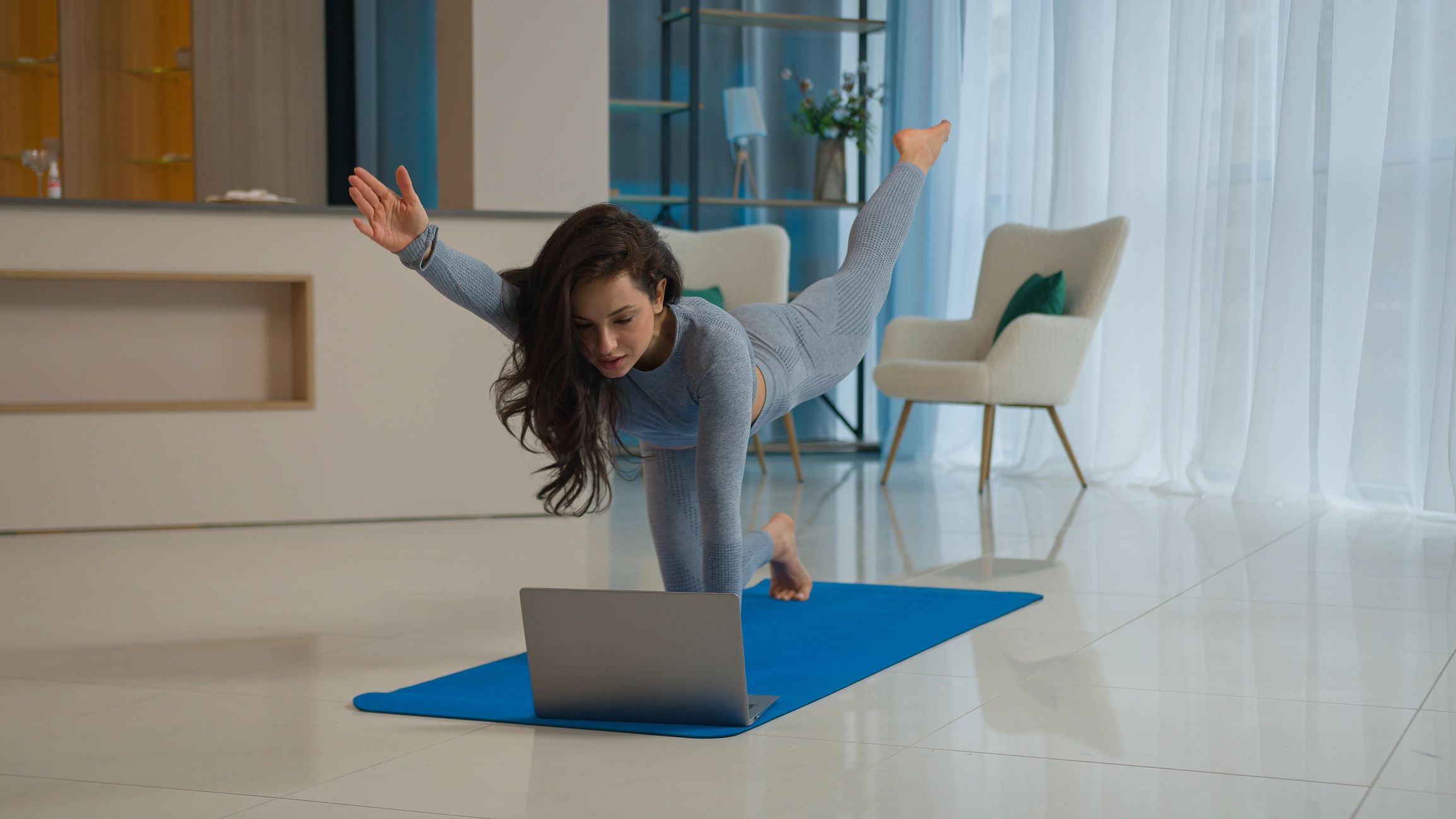 Yoga class with laptop workout video tutorial online